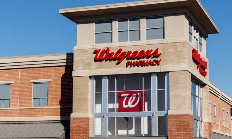 A walgreens pharmacy store front with the sign for walgreens pharmacy.